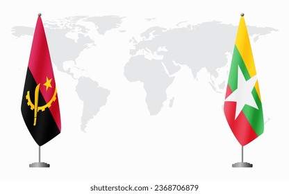 Angola and Myanmar flags for official meeting against background of world map.