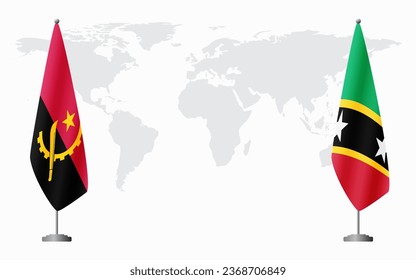 Angola and Saint Kitts and Nevis flags for official meeting against background of world map.