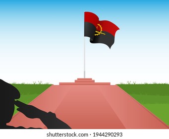 Angolan flag on a pole with the image of a soldier saluting the flag