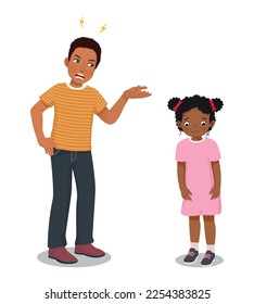 Angry African father scolding his little son for bad behavior