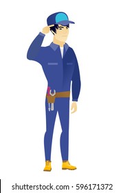 Angry asian mechanic gesturing with his finger against his temple. Full length of young mechanic twisting his finger against temple. Vector flat design illustration isolated on white background.