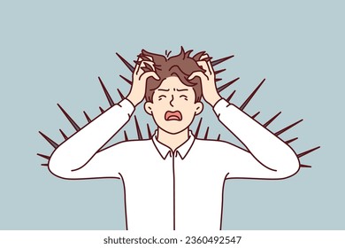 Angry business man with thorns sticking out of body screams and grabs head suffering from skin irritation. Angry young guy in formal shirt needs dermatologist for scabies or allergies
