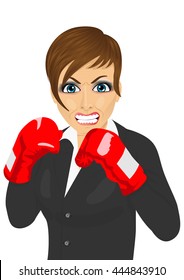 Angry business woman ready to fight with boxing gloves