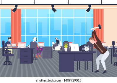 angry businessman hitting alarm clock by hummer tired business man trying to destroy classic watch on workplace desktop deadline concept modern co-working office interior full length horizontal