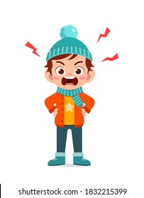angry cute little kid scream and wear jacket in winter season. child shout wearing warm clothes