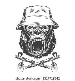 Angry gorilla head in panama hat with crossed native american indian smoking pipes in vintage monochrome style isolated vector illustration