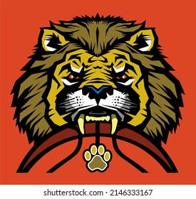 angry lion mascot biting a basketball for school, college or league