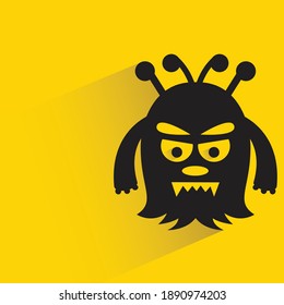 angry monster with shadow on yellow background