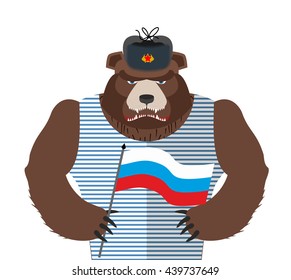 Angry Russian bear holding Russian flag. Beast patriot in fur hat and vest. Wild animal in clothes on  white background