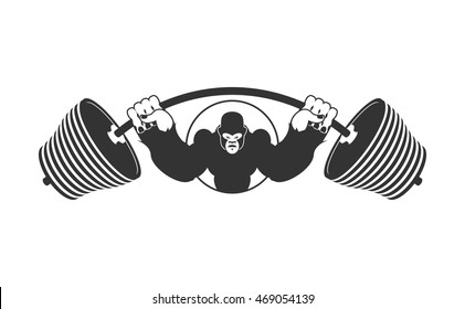 Angry strong Gorilla and  Barbell. athlete Aggressive big monkey. evil wild animal bodybuilder. logo for sports team
