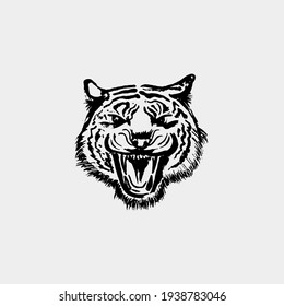 Angry Tiger Face. Black paint, ink brush strokes, brushes, lines, grunge. Freehand drawing. Vector illustration. Isolated on white background.