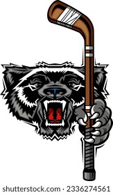 angry wolverine mascot holding hockey stick for school, college or league sports