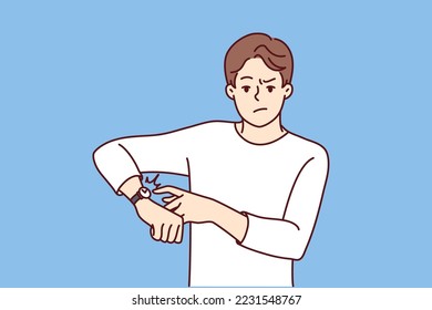Angry young man point at wristwatch warn about deadline. Mad male notify about missing time showing on clock on wrist. Vector illustration. 