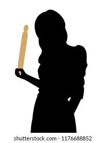 Angry young woman holding a rolling pin in her hand
