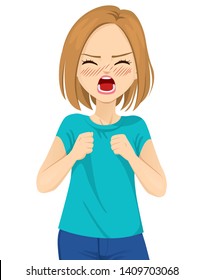 Angry young woman screaming with wild open mouth and closed fists on white background 