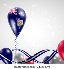 Anguilla flag on balloon. Celebration and gifts. Ribbon in the colors are twisted. Balloons on the feast of the national day. 
