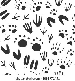 Vector de huella animal patrón sin fisuras en un fondo blanco.
