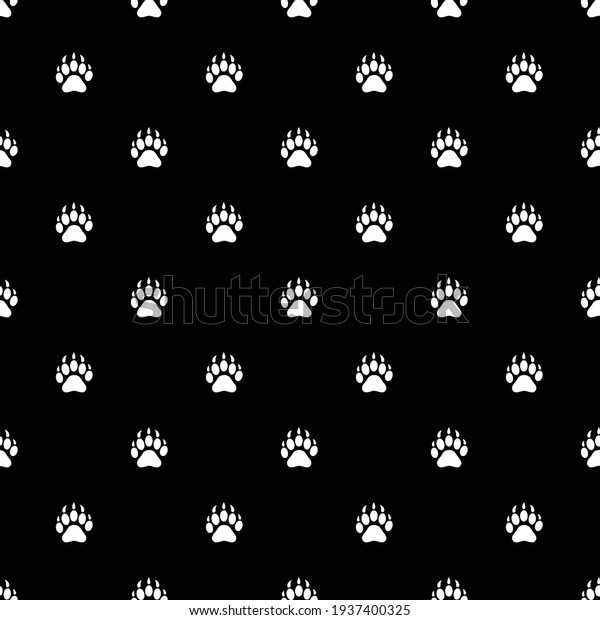 Animal footprints seamless pattern. Paws on a black background. Vector print