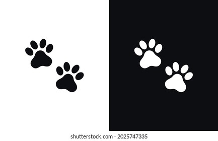 Animal pawprint icon isolated on white and black background.