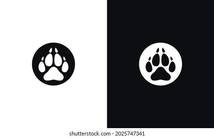 Animal pawprint icon isolated on white and black background.