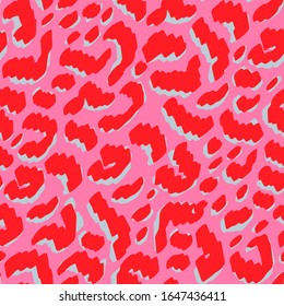 Animal print in non-traditional pink and red colors. Abstract shapes inspired by leopard fur. Hand drawn objects arranged as repeat design for fabric, fashion textile or wallpaper.