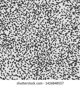 Animal print seamless pattern design with small black spots on light grey background. Vector seamless pattern with black brush strokes on white background.