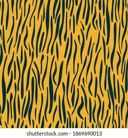 Animal print. Tiger stripes. Seamless pattern with dark streaks on yellow background