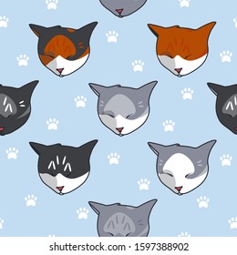 Animal seamless pattern: sleeping cats on blue background paw prints. Pattern for textile, fabric and paper. Vector illustration in cute cartoon style