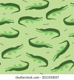 Animal seamless pattern and textile design. Vector illustration with cute green crocodile on light green background. Good for t-shirt design, fabric print, greeting card, wrapping, wallpapers.