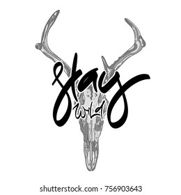 Animal skull with hand drawn lettering - "Stay wild" Monochrome Vector illustration. Typography design elements for prints, cards, posters, products packaging, branding.