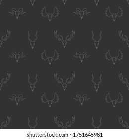 Animal skulls isolated on a grey background pattern. Vector icon design on seamless pattern. 