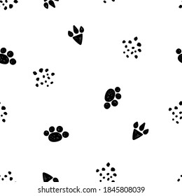 Animal tracks on a white background. Seamless pattern in Scandinavian style