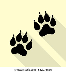 Animal Tracks sign. Black icon with flat style shadow path on cream background.