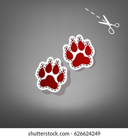 Animal Tracks sign. Vector. Red icon with for applique from paper with shadow on gray background with scissors.