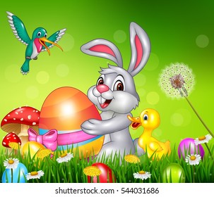 Animals and Easter eggs on green grass