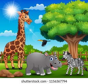 The animals are enjoying nature by the cage