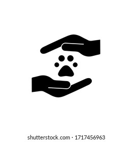 Animals help black silhouette vector illustration isolated on white background. Animal footprint, trace in hands. Voluntary, charity, donation icon.