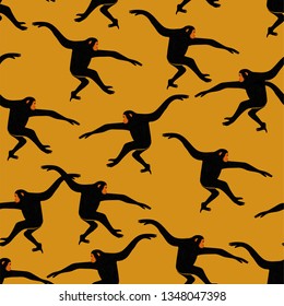 Animals print. Seamless pattern with funny gibbon monkey silhouette on an yellow background.