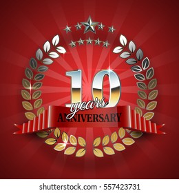 Anniversary 10th gold wreath with red ribbon.
