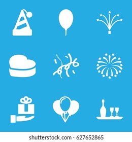 Anniversary icons set. set of 9 anniversary filled icons such as heart cake, balloon, fireworks, confetti, wine bottle and glass, gift on hand