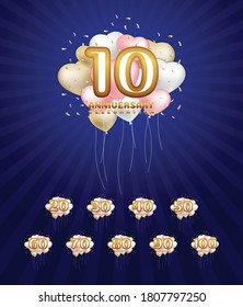 Anniversary numbers on heart shaped balloons and confetti are cute beautiful