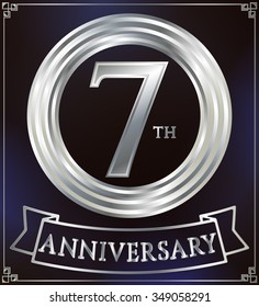 Anniversary silver ring logo number 7. Anniversary card with ribbon. Blue background. Vector illustration.