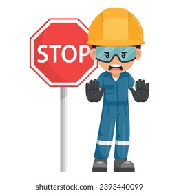 Annoyed industrial mechanic worker with stop sign. Engineer with his personal protective equipment. Safety first. Industrial safety and occupational health at work