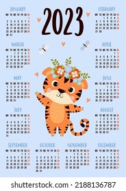 Annual calendar for 2023 with happy cute tiger with butterflies. Vector vertical template for 12 months in English. Week starts on Monday. Stationery, printing, organizer, decor, kids collection