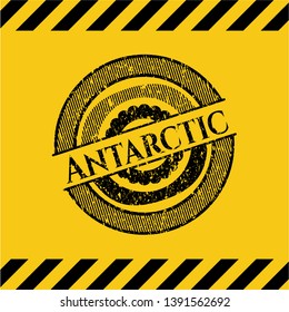 Antarctic black grunge emblem with yellow background. Vector Illustration. Detailed.