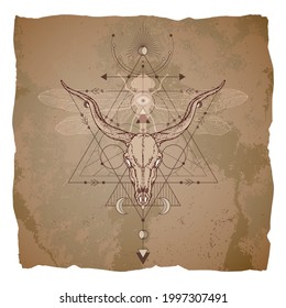 Antelope skull, dragonfly and Sacred geometric symbol on vintage paper background with torn edges. Abstract mystic sign. Image in sepia color. 