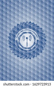 antenna signal icon inside blue emblem or badge with geometric pattern background.
