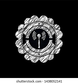 antenna signal icon inside chalk emblem written on a blackboard