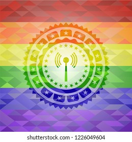antenna signal icon inside emblem on mosaic background with the colors of the LGBT flag