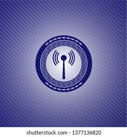 antenna signal icon inside emblem with denim texture